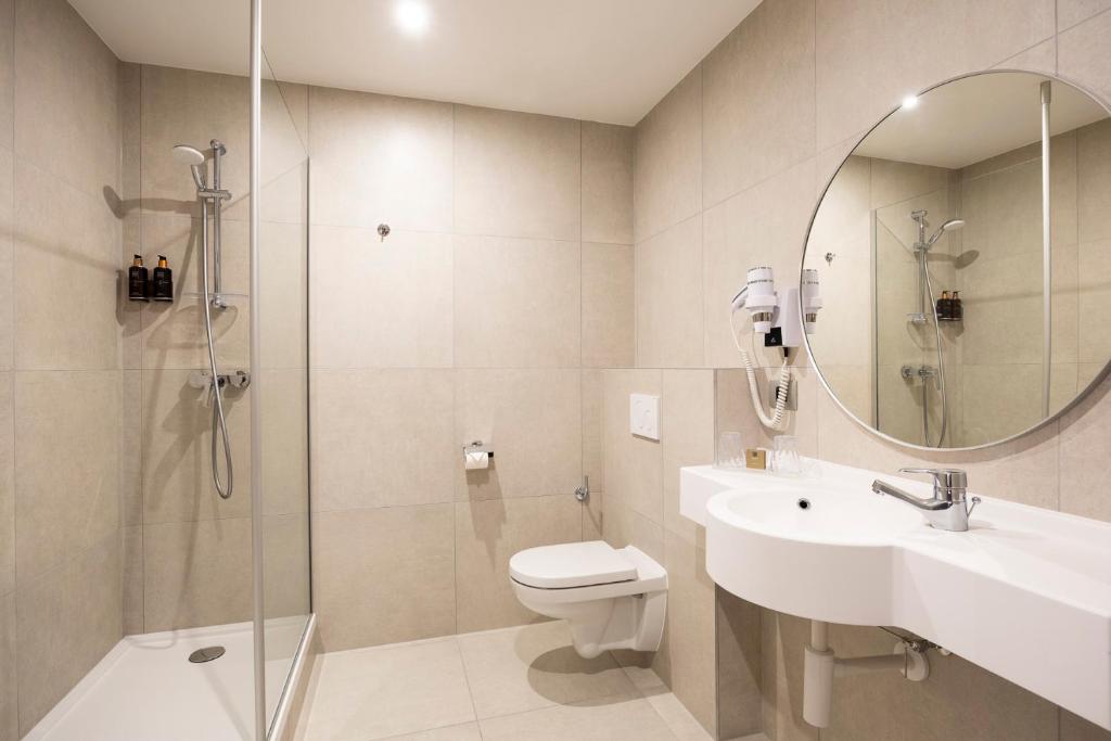 Koupelna v ubytování Aris Grand Place Hotel