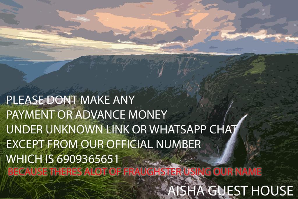 a poster of a waterfall in the mountains at Aisha Guest House Bed & Breakfast in Cherrapunji