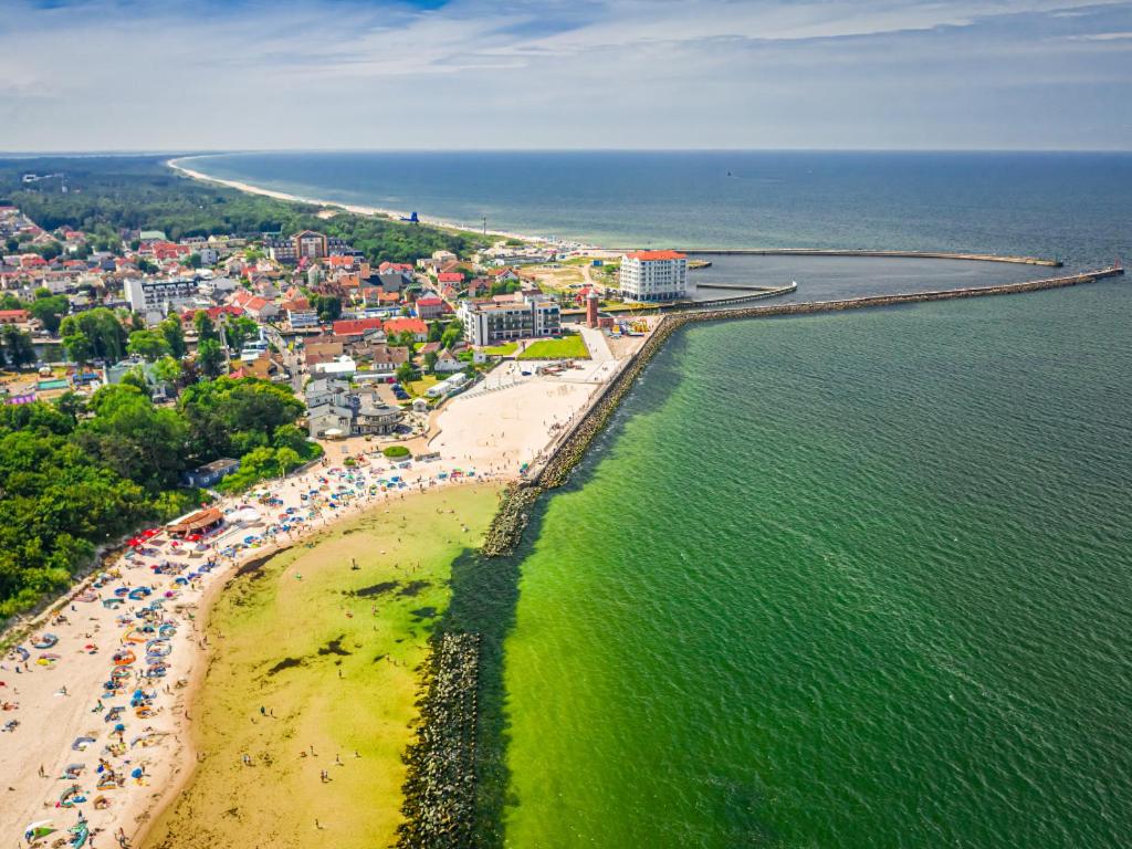 an aerial view of a beach and the ocean at Sunny Apartament in Darłowo