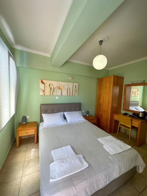 Łóżko lub łóżka w pokoju w obiekcie Antonia Apartments