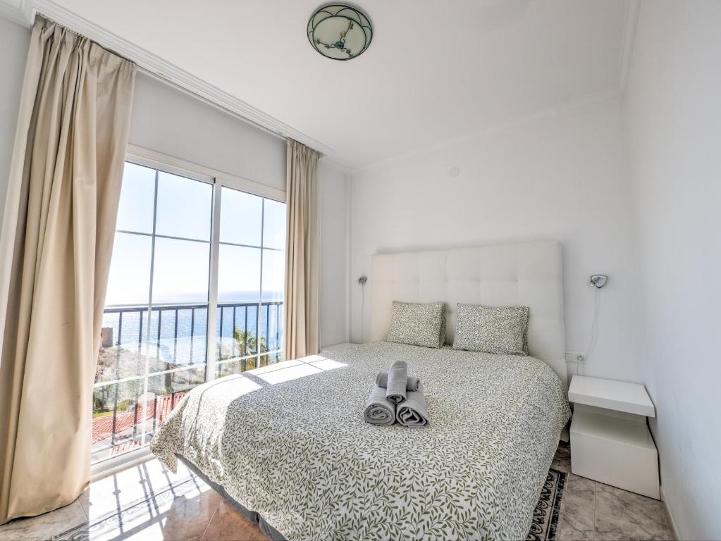 Posteľ alebo postele v izbe v ubytovaní Amazing villa with magical view and pool in Nerja
