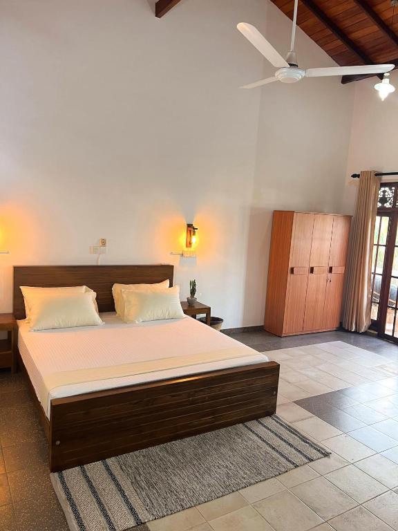 Postel nebo postele na pokoji v ubytování Hummus Hostel Hikkaduwa