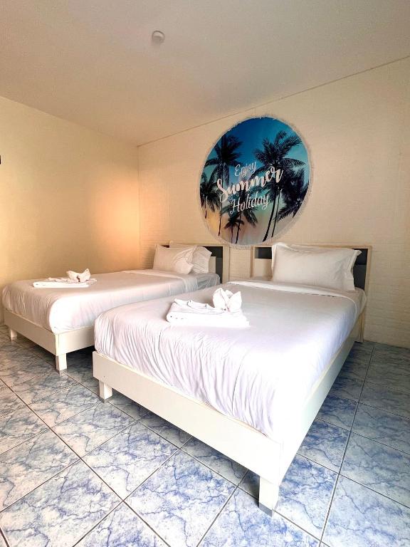 Postel nebo postele na pokoji v ubytování Baankasemsuk Resort 般咔 深宿