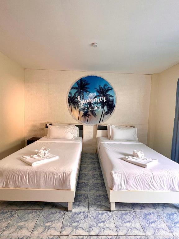 Postel nebo postele na pokoji v ubytování Baankasemsuk Resort 般咔 深宿