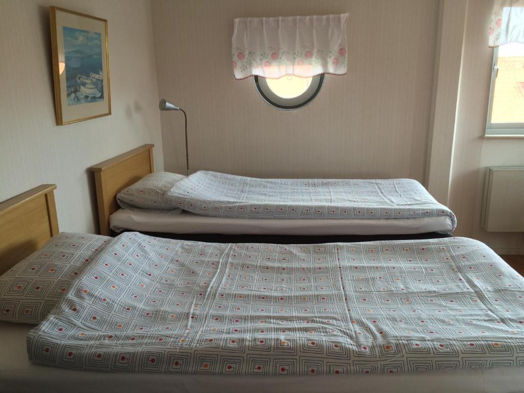 Postel nebo postele na pokoji v ubytování Wellingehus Hotel