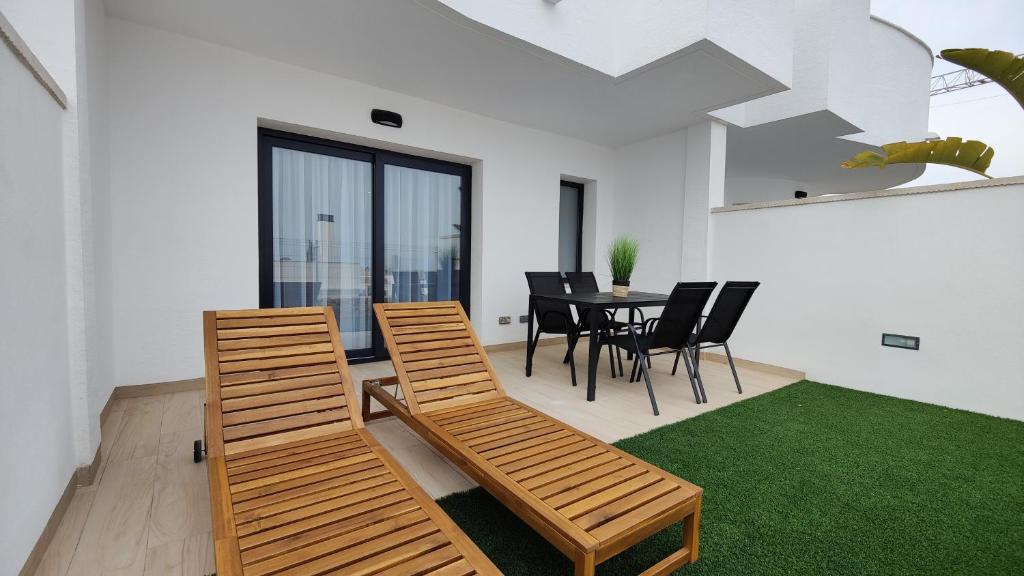 a dining room with a table and chairs at PANORAMIC design home in Finestrat