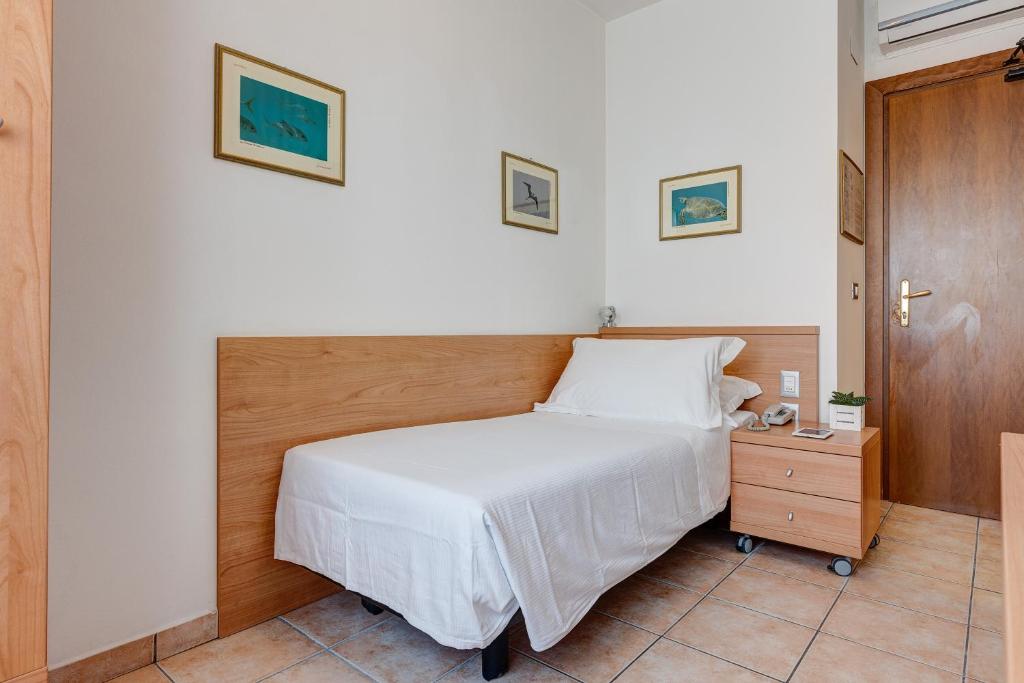 Postel nebo postele na pokoji v ubytování Hotel Piccadilly