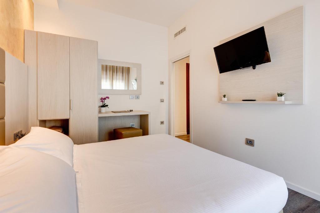 Postel nebo postele na pokoji v ubytování Hotel Piccadilly