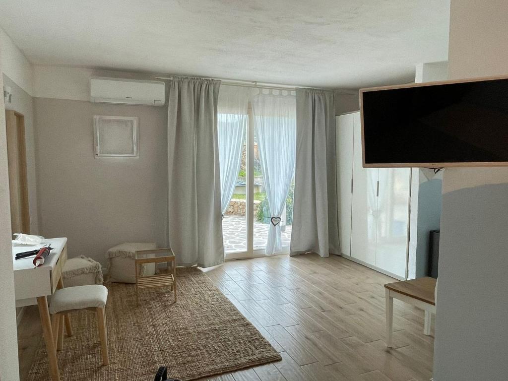 TV a/nebo společenská místnost v ubytování La Pecora Nera B&B
