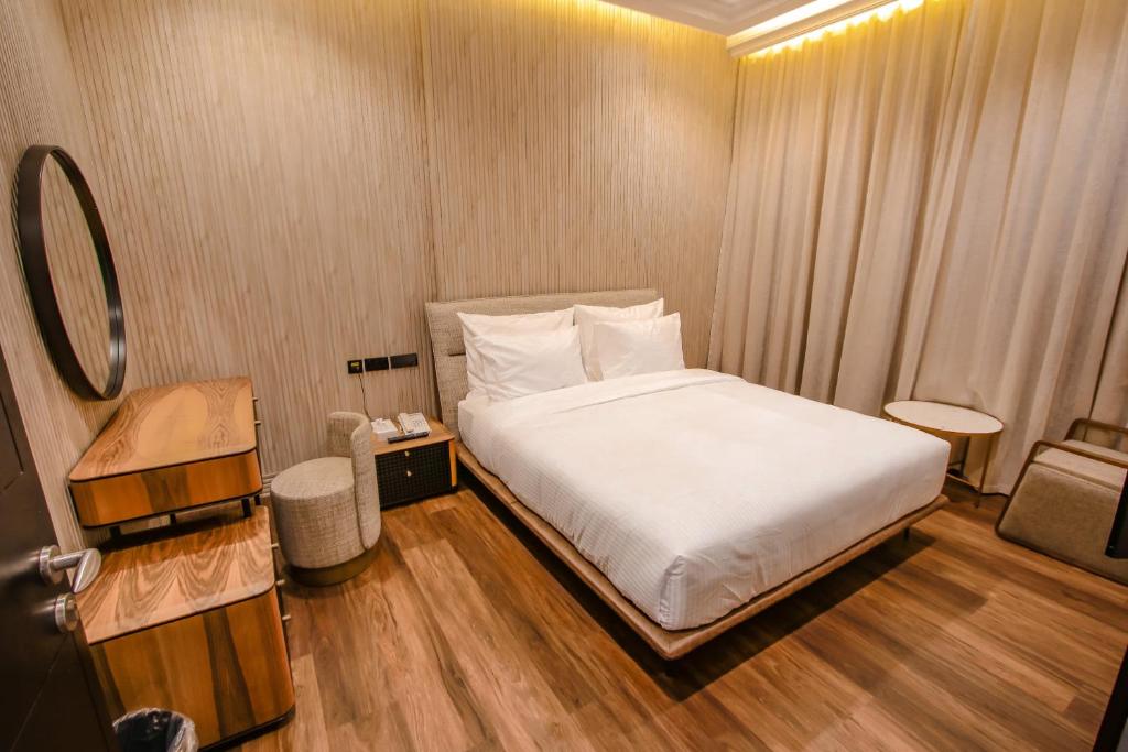 Postel nebo postele na pokoji v ubytování M14 Hotel Apartment