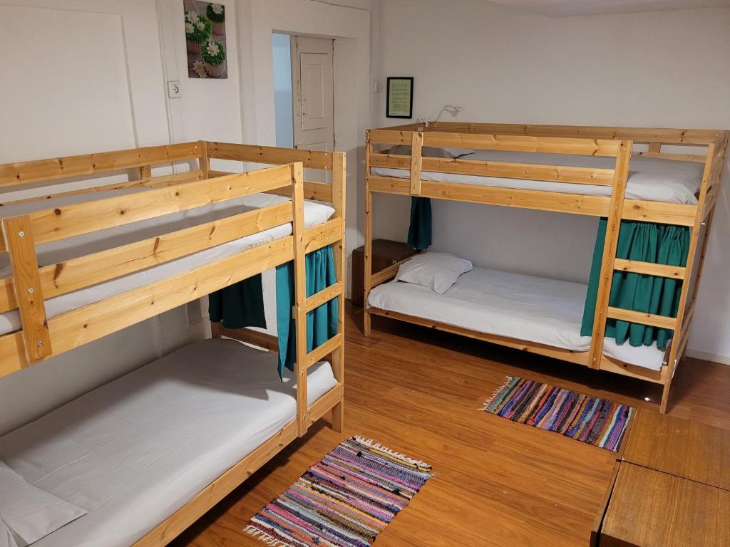 Postel nebo postele na pokoji v ubytování inBraga Hostel