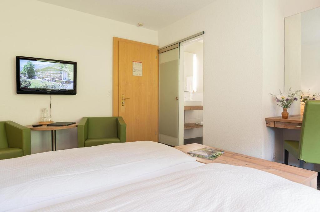 Postel nebo postele na pokoji v ubytování Hotel Restaurant Alpina