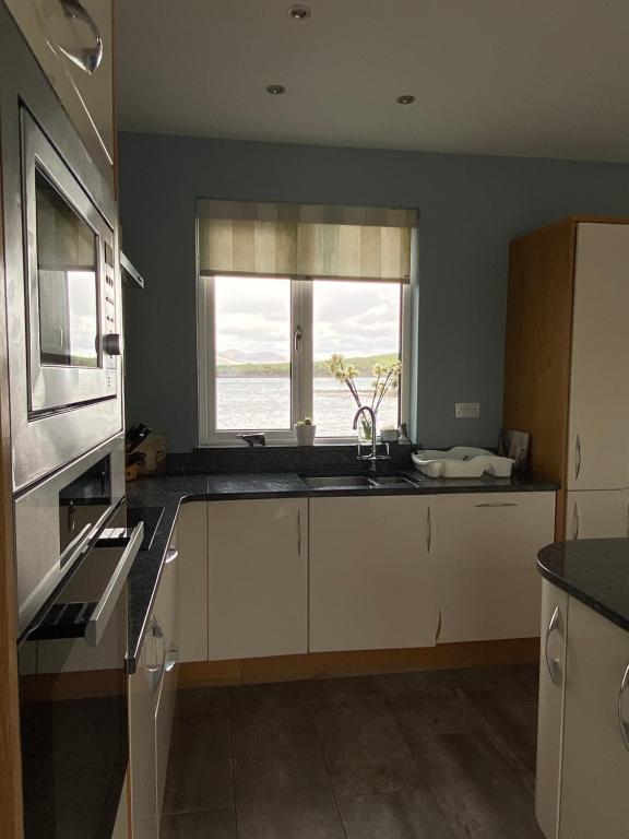 Kuchyň nebo kuchyňský kout v ubytování Seapoint House
