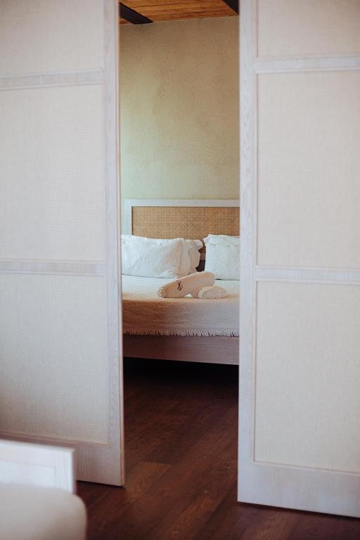 Łóżko lub łóżka w pokoju w obiekcie La Pampa Relais & Spa