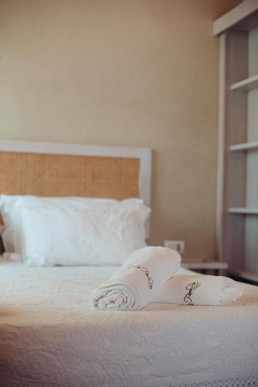 Łóżko lub łóżka w pokoju w obiekcie La Pampa Relais & Spa