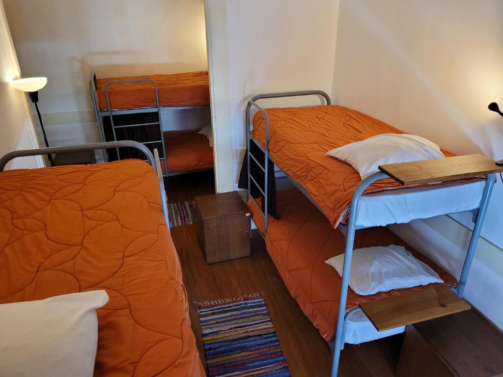 Postel nebo postele na pokoji v ubytování inBraga Hostel