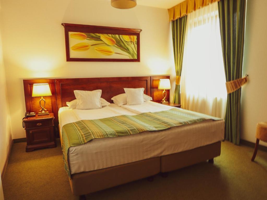Postel nebo postele na pokoji v ubytování Hotel Residenz