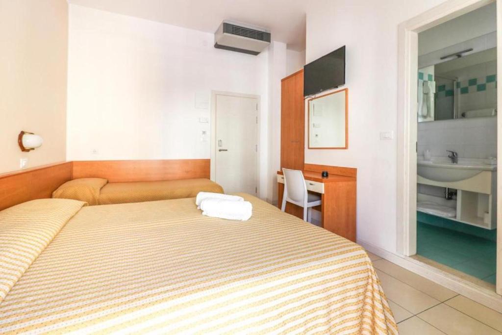 Postel nebo postele na pokoji v ubytování Hotel Jesulum