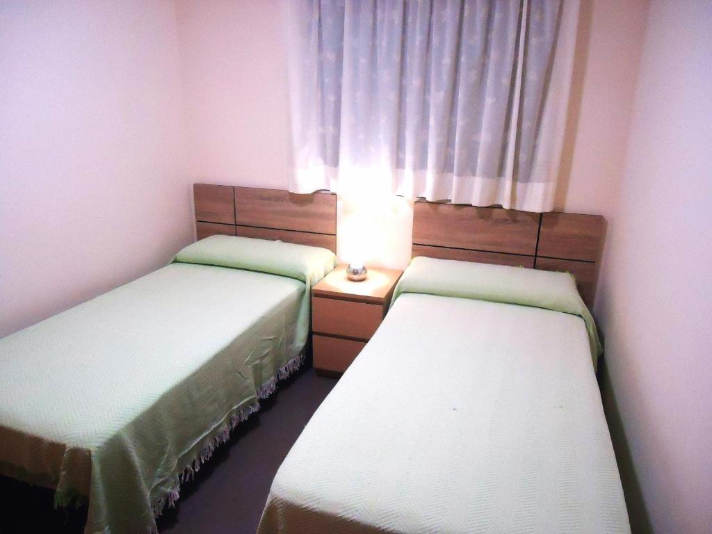 Posteľ alebo postele v izbe v ubytovaní Edificio Papa Luna