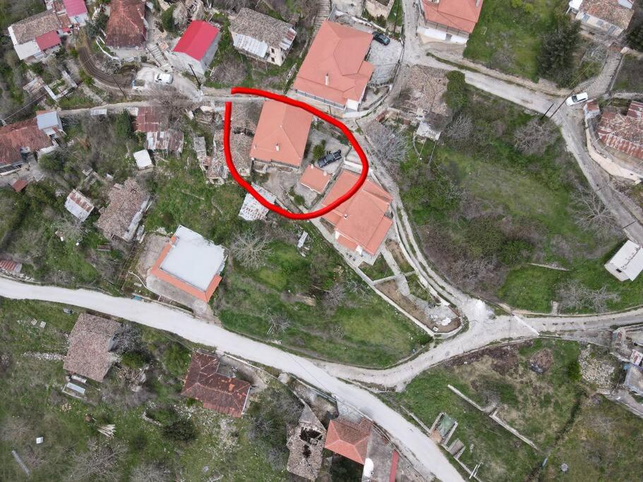 a house with a red spot on top of it at Peak heaven in Feneos