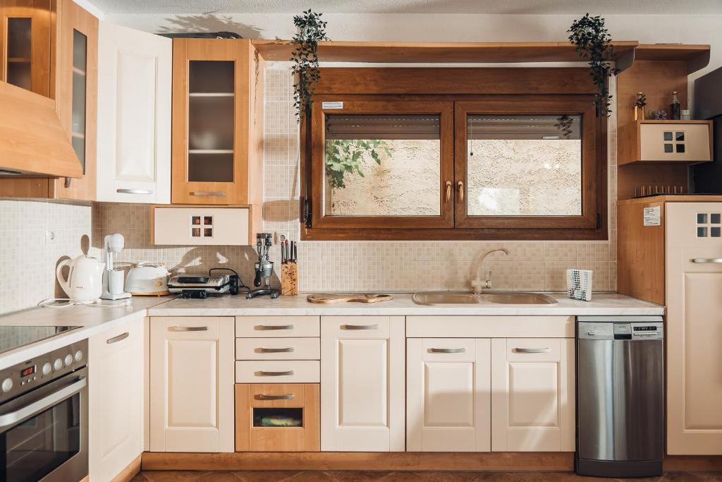 A kitchen or kitchenette at Private pool villa