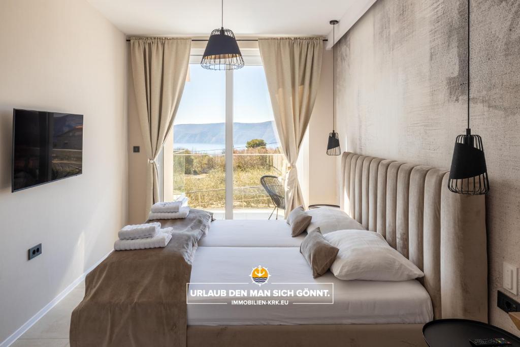 Posteľ alebo postele v izbe v ubytovaní Villa Neoma
