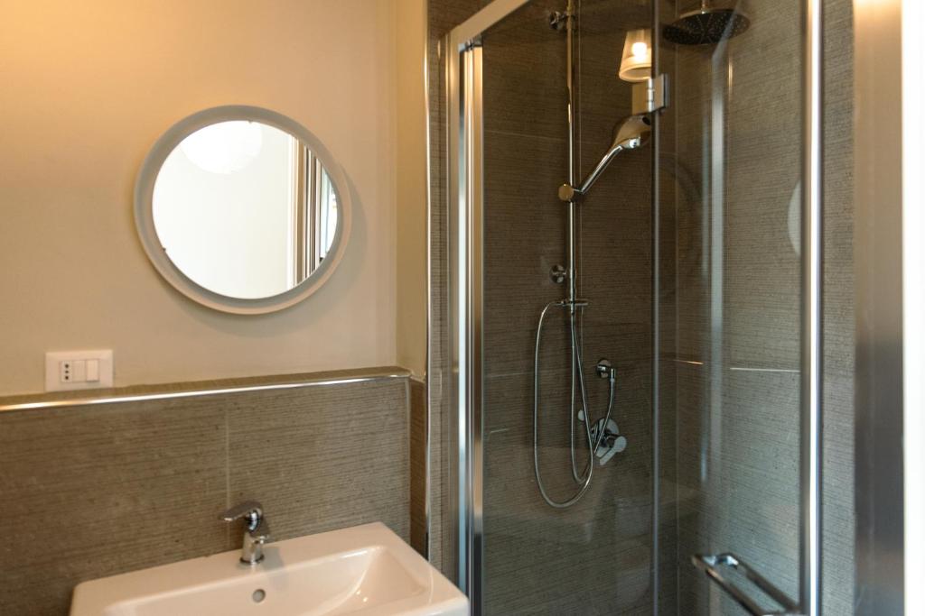 a bathroom with a sink and a shower with a mirror at Tenuta Mastro in Sulmona