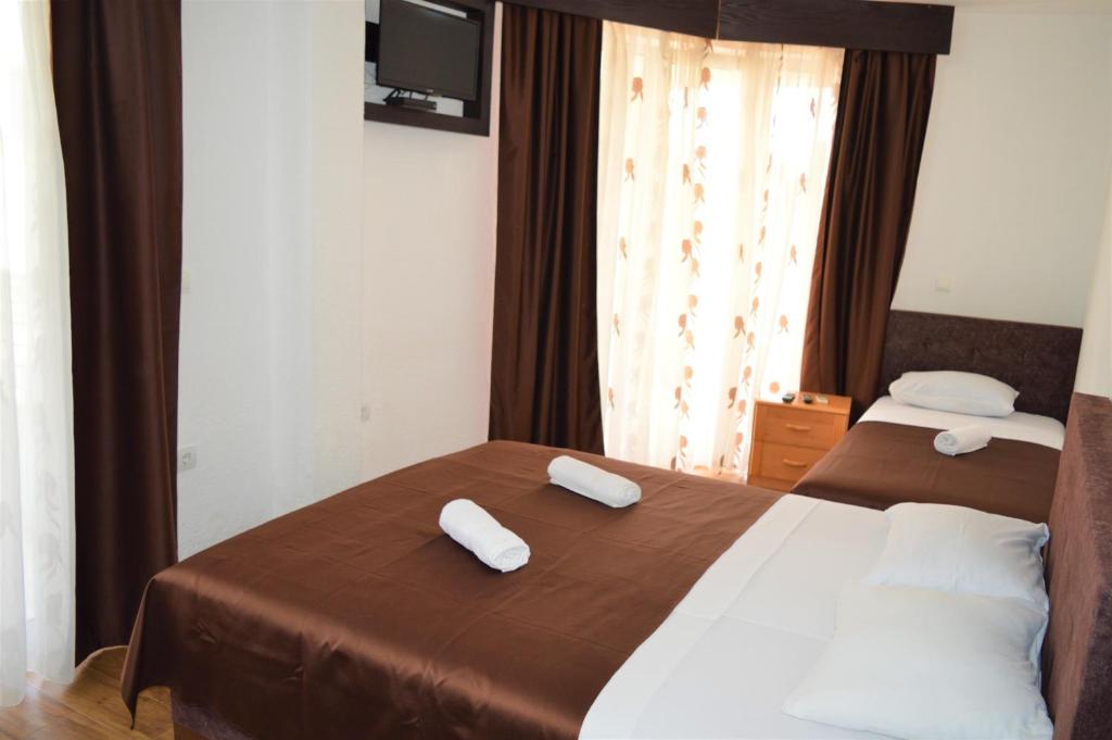 Postel nebo postele na pokoji v ubytování MS Hotel