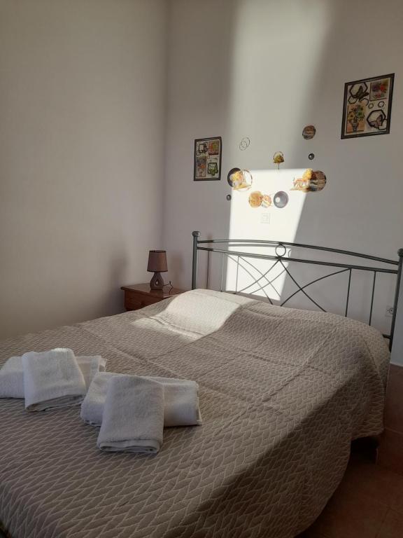 Postel nebo postele na pokoji v ubytování Aggeliki's Apartments