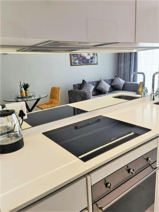 a kitchen with a stove top oven in a room at Executive Suite at Ellipse in Waterfall Midrand in Midrand