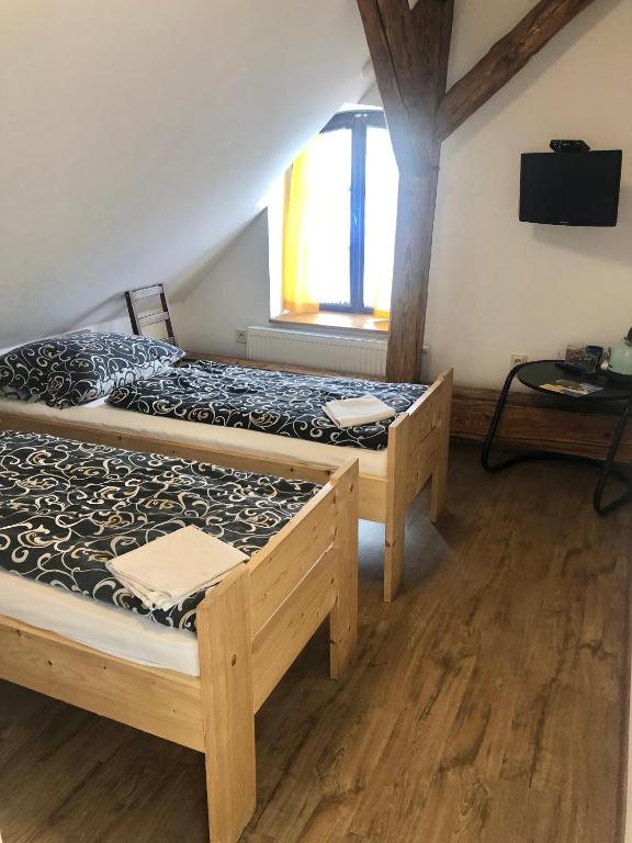 Postel nebo postele na pokoji v ubytování Penzion Ambrozie