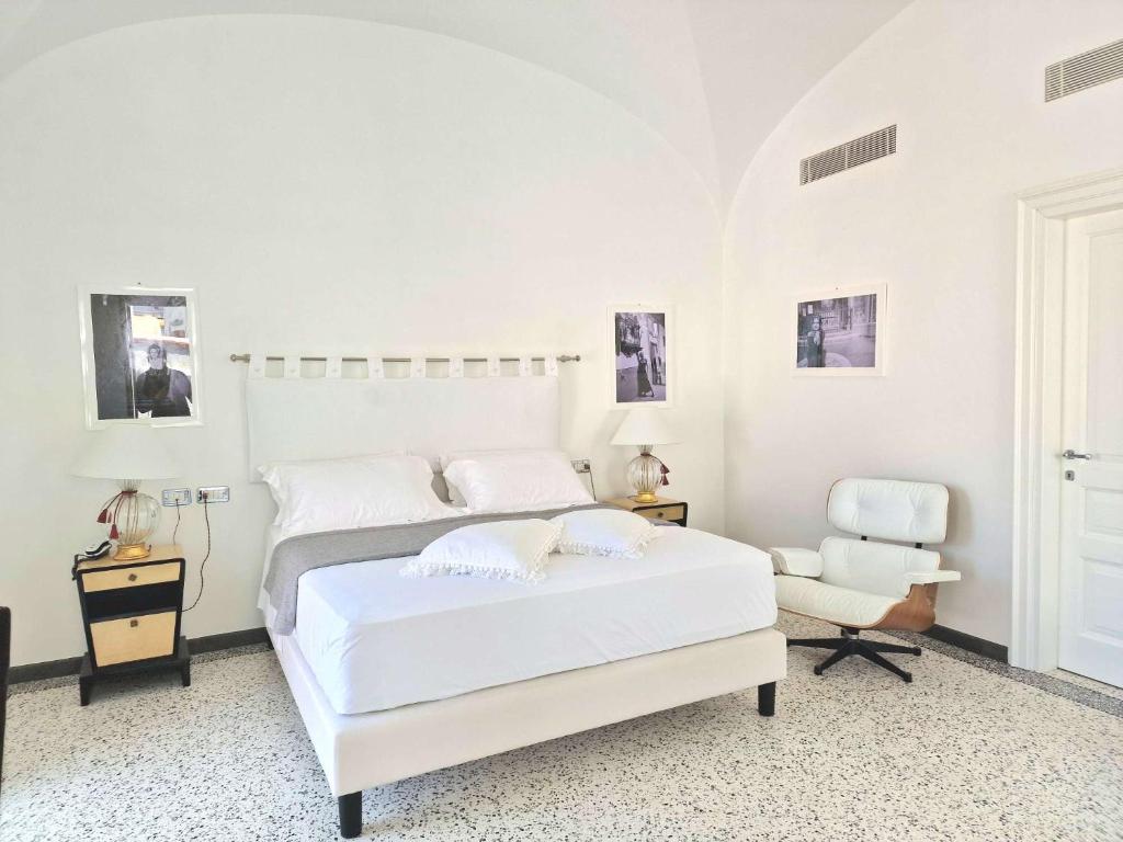 Postel nebo postele na pokoji v ubytování Roccobarocco Boutique Hotel