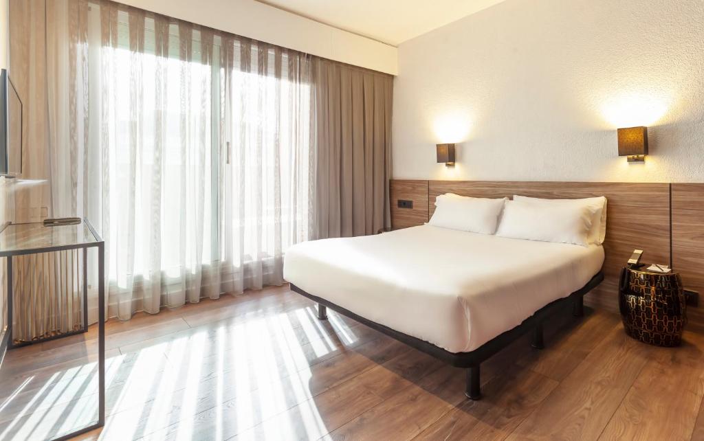 Posteľ alebo postele v izbe v ubytovaní Hotel Derby