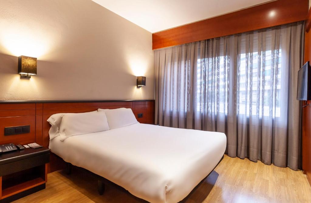 Posteľ alebo postele v izbe v ubytovaní Hotel Derby