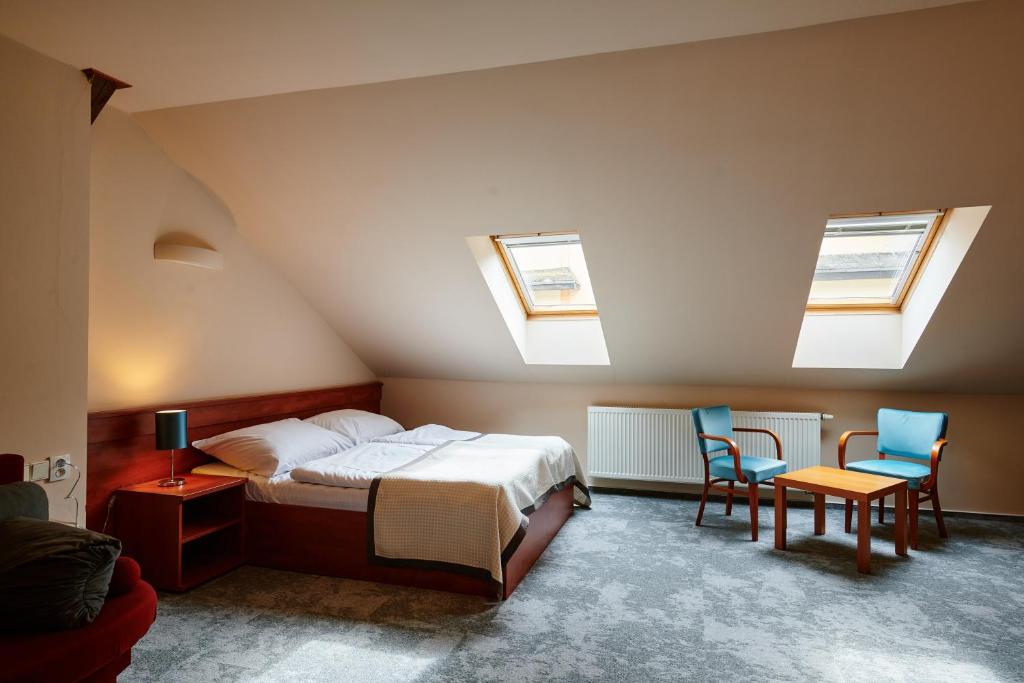 Postel nebo postele na pokoji v ubytování Hotel Terasa