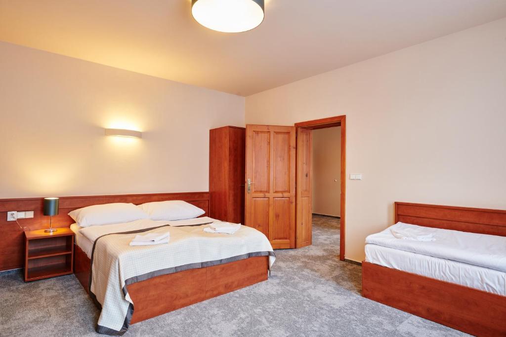 Postel nebo postele na pokoji v ubytování Hotel Terasa