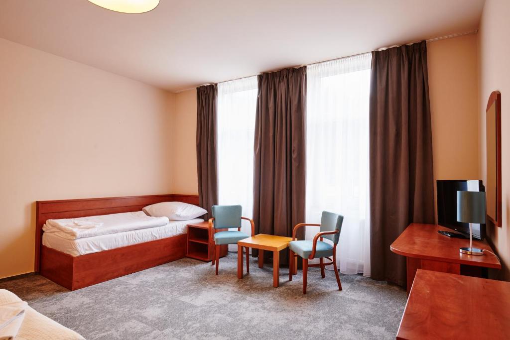 Postel nebo postele na pokoji v ubytování Hotel Terasa