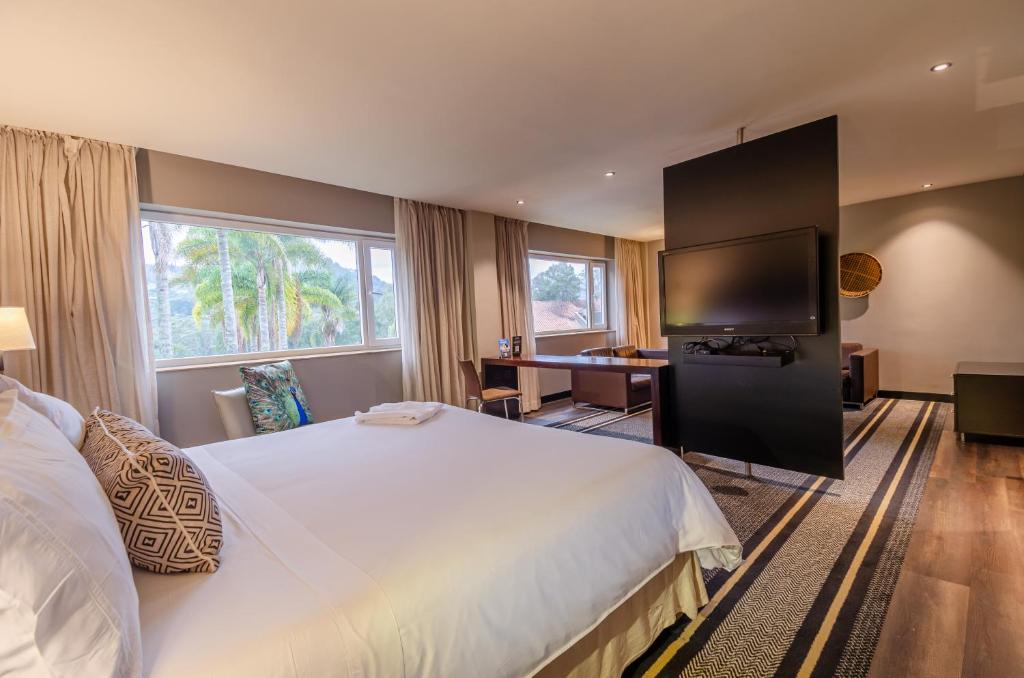 Postel nebo postele na pokoji v ubytování Movich Hotel Las Lomas