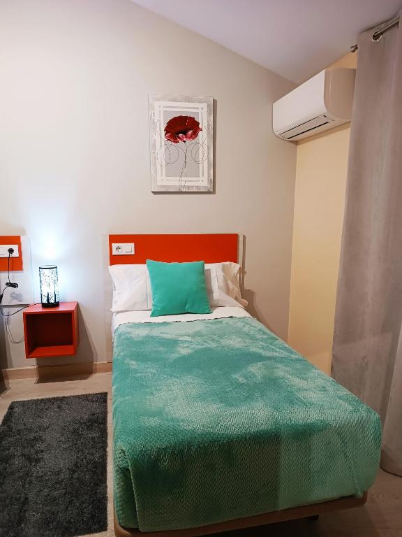 Postel nebo postele na pokoji v ubytování Hotel Alma Rosa