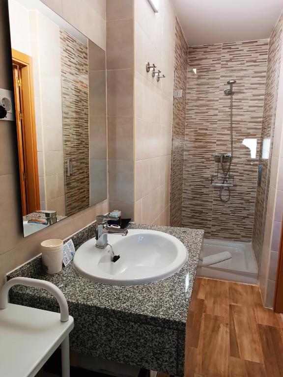 Koupelna v ubytování Hotel Alma Rosa