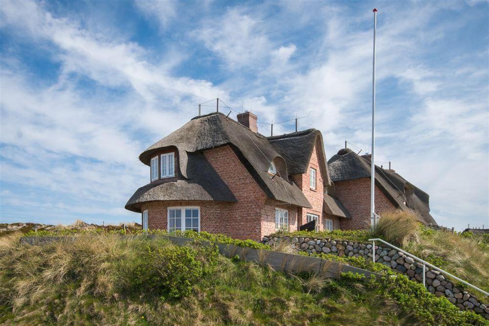 a house sitting on top of a hill at Haus-Meerblick in Rantum