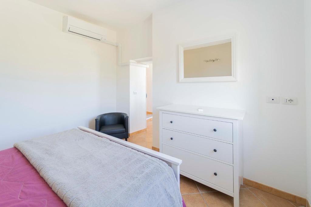 Posteľ alebo postele v izbe v ubytovaní CASA VACANZA IL PORTICO