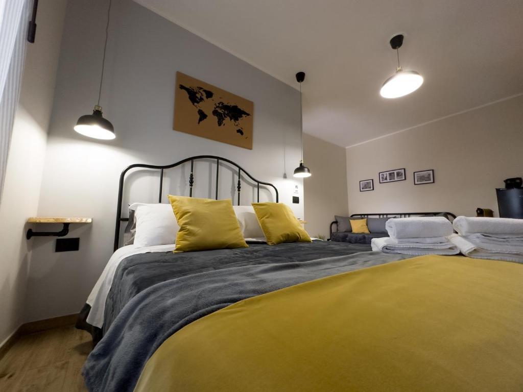 Postel nebo postele na pokoji v ubytování Nicarè Rooms