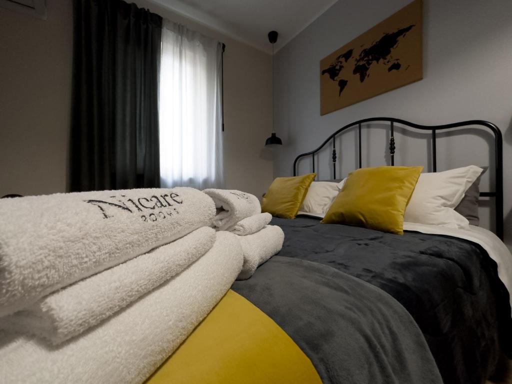 Postel nebo postele na pokoji v ubytování Nicarè Rooms