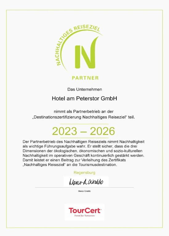 a white resume with a n logo on it at Hotel am Peterstor in Regensburg