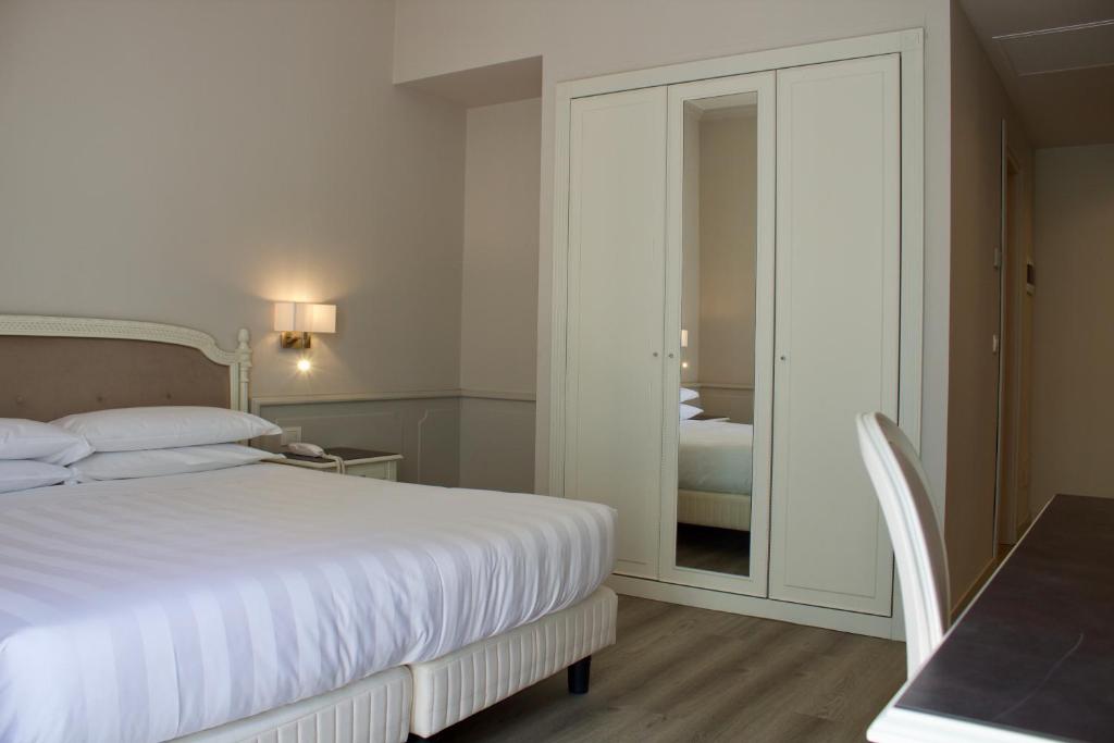 Letto o letti in una camera di Parco dei Principi Boutique Hotel