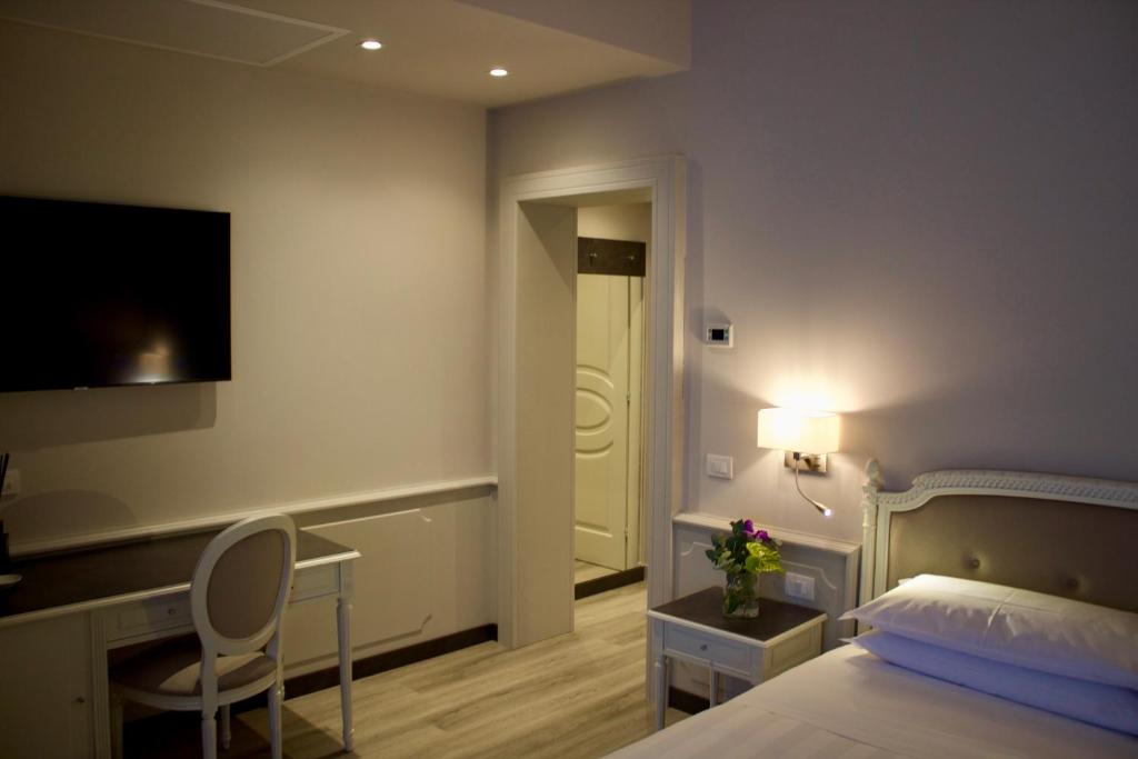 Letto o letti in una camera di Parco dei Principi Boutique Hotel