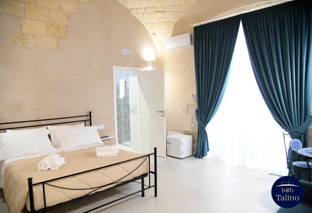 Postel nebo postele na pokoji v ubytování B&B Talino