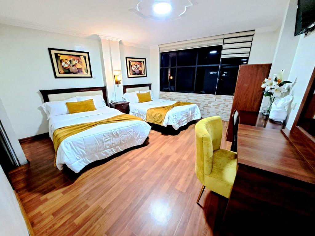 Postel nebo postele na pokoji v ubytování Hotel Virgen del Cisne
