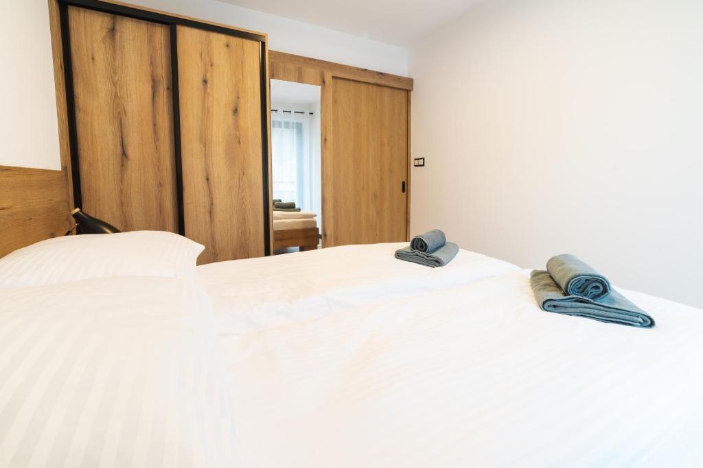 Postel nebo postele na pokoji v ubytování Apartamenty Pod Wyciągiem